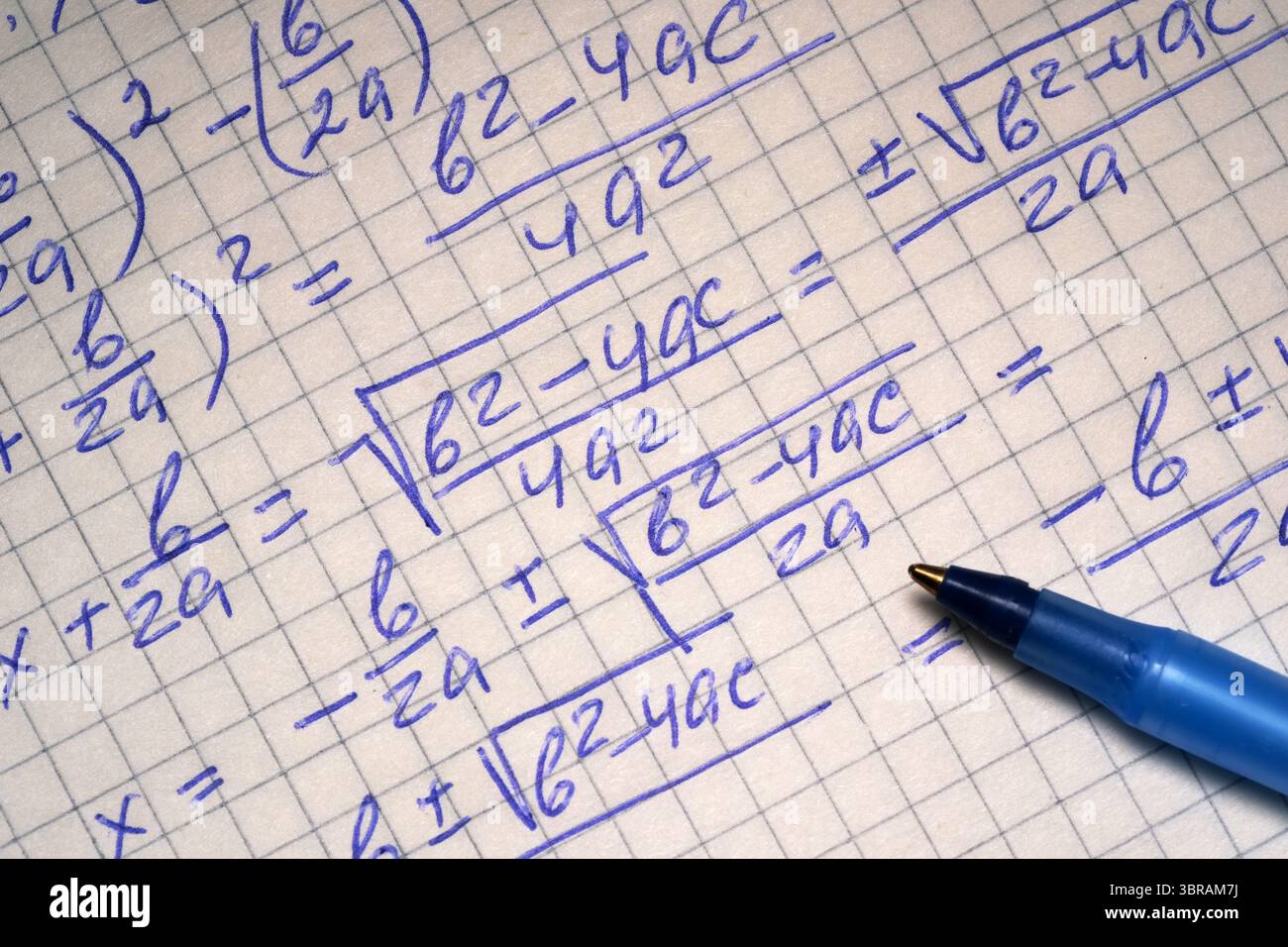 Calculaations Intricate algebraic calculations are being carefully written by hand ...