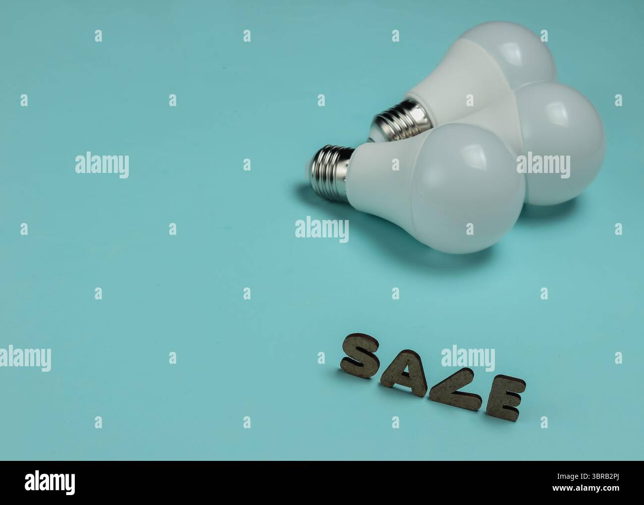 Eco three LED light bulbs on blue background. Stock Photo