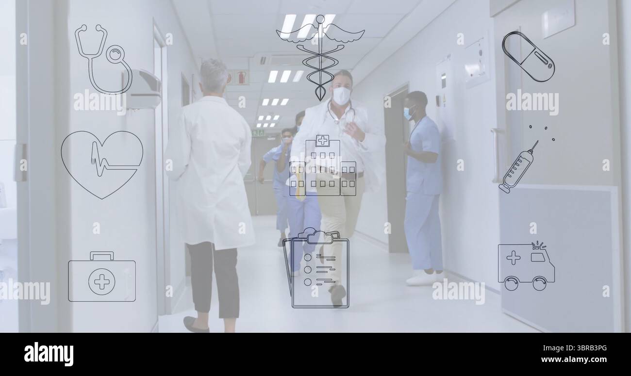 Running doctor wearing white lab coat mask badge in hospital corridor with nurses in blue scrubs Stock Photo