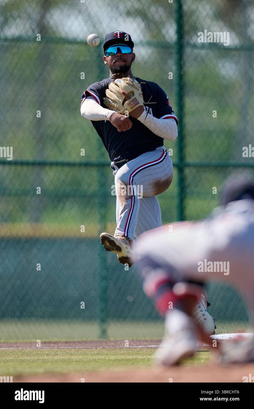 FCL Twins third baseman Bryan Acuna (13) throws to first base during an ...