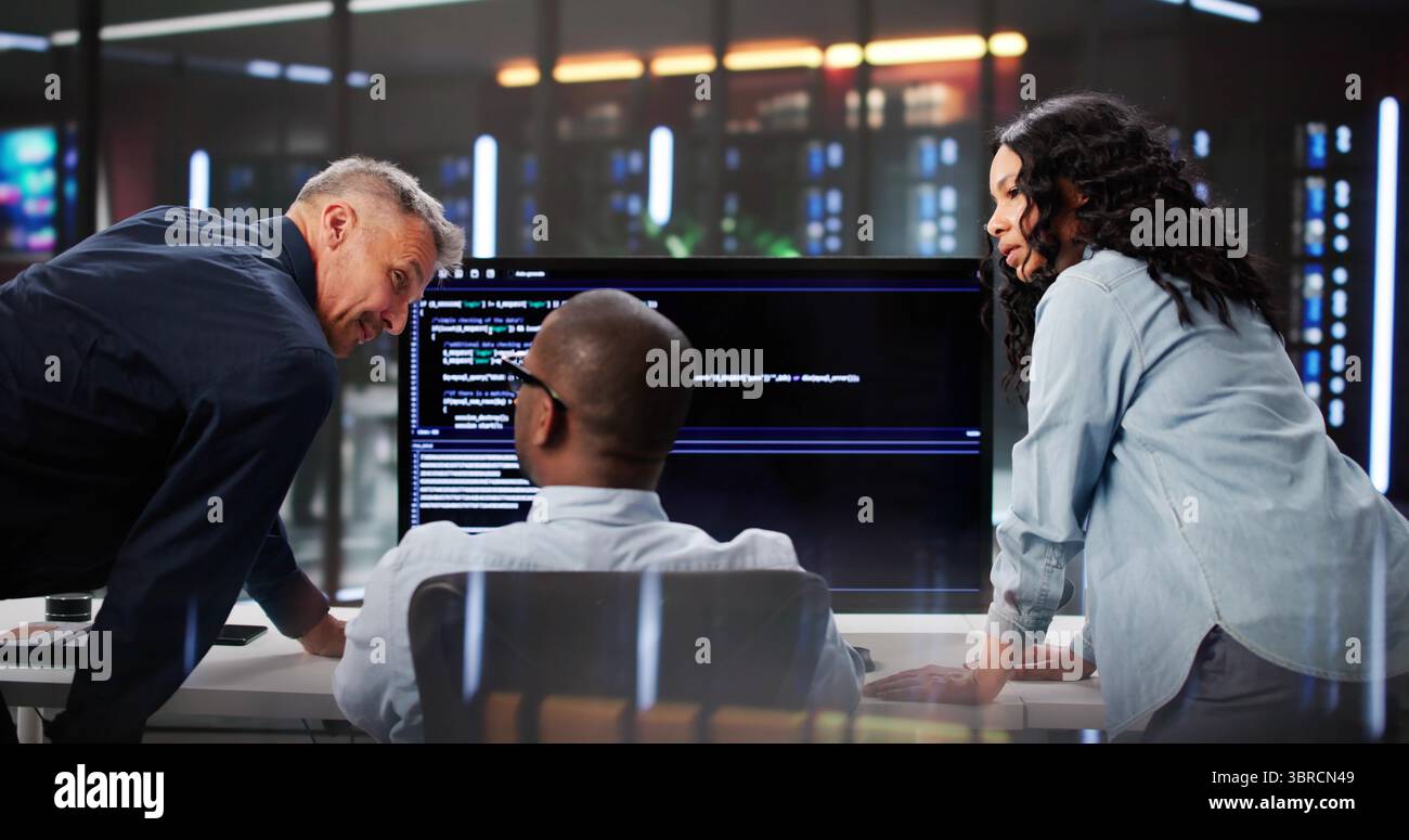 Agile Professionals Collaborate On Programming Efficiency In Diverse Team Setting. Stock Photo