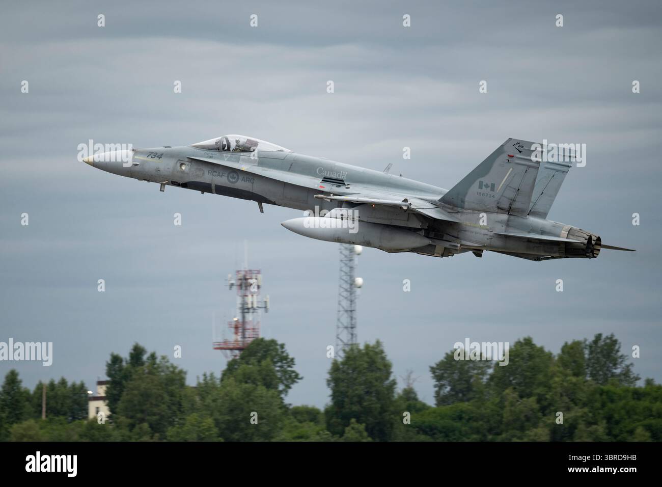 A North American Aerospace Defense Command CF-18 Hornet takes off for a training mission over Adak from Joint Base Elmendorf-Richardson, Alaska, July Stock Photo