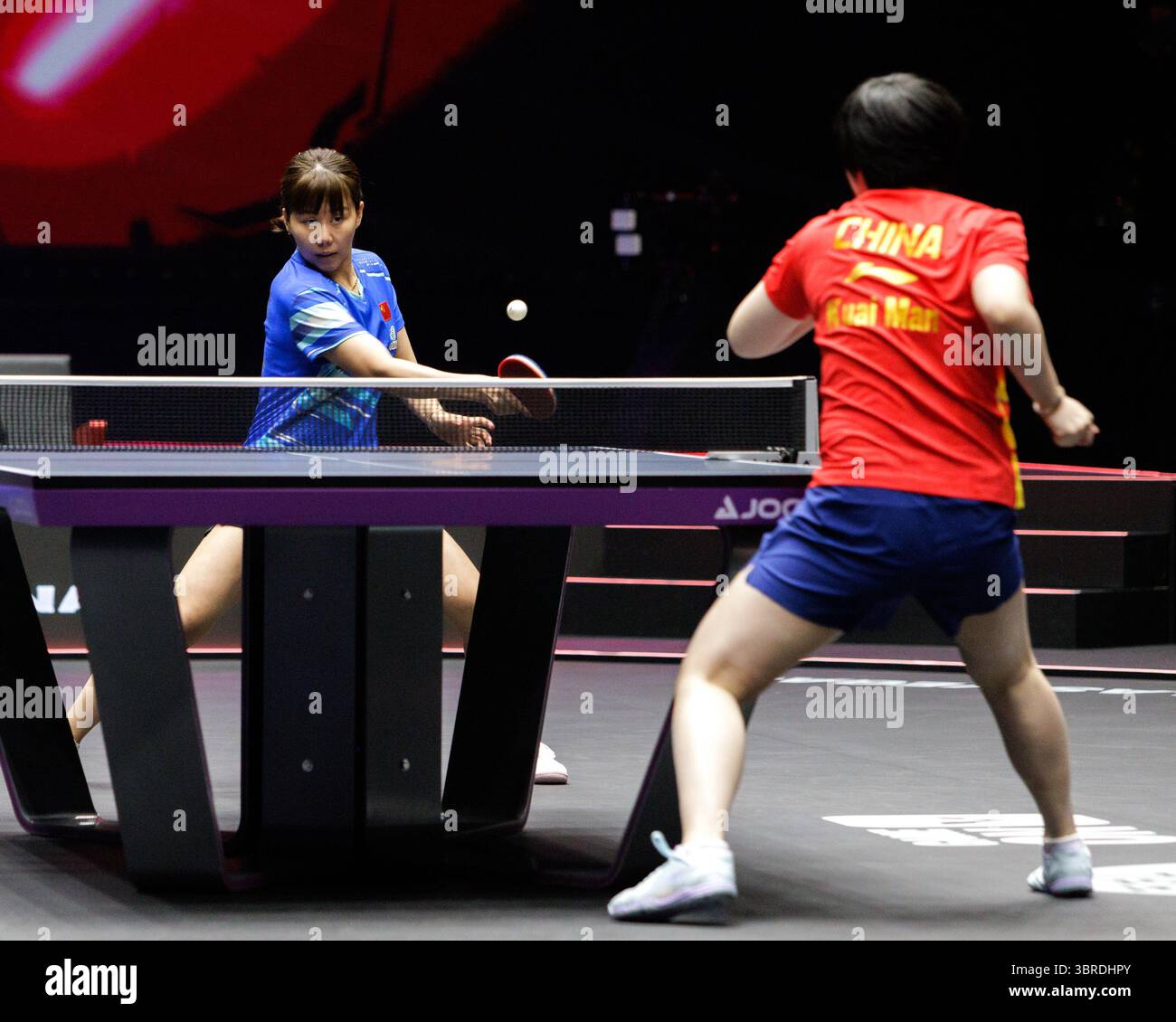 Xingtong Chen (China) in blue and Man Cuai (China) in red compete in ...