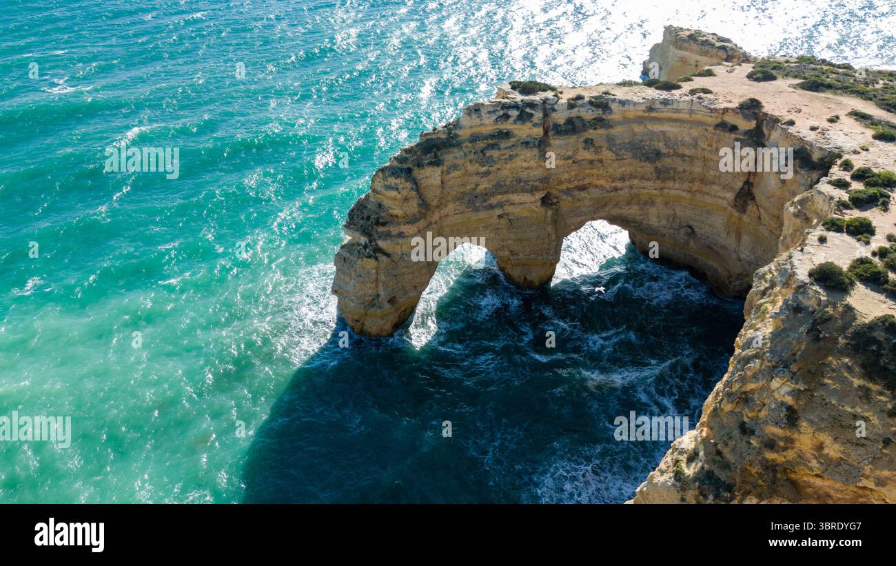 Aerial view of the rugged Algar Seco rock formations arching over the ...