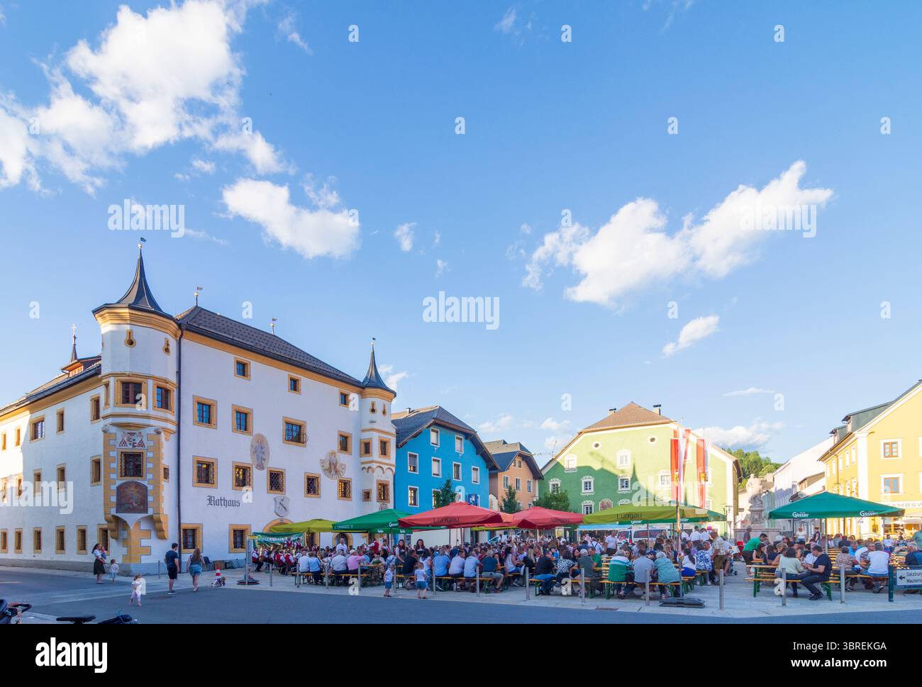 Tamsweg: square Marktplatz, Town Hall, music festival, people at beer garden tables in Lungau, Salzburg, Austria Stock Photo