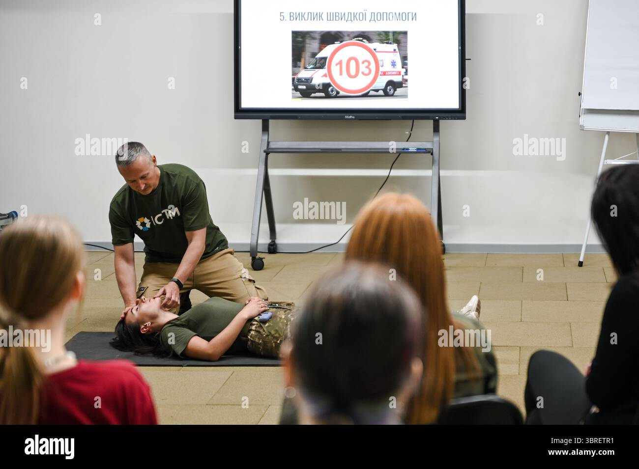 Non Exclusive: An instructor demonstrates emergency positioning ...