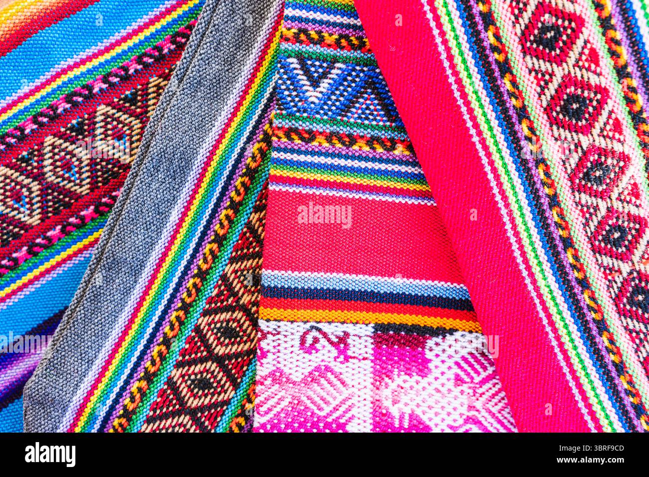 Colorful hand-woven Inca textile background with ancient designs from ...