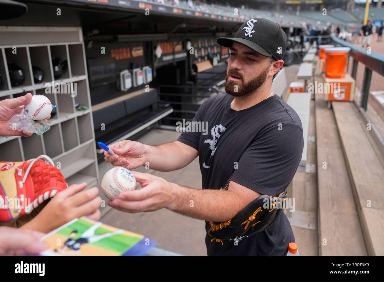 Chicago White Sox pitcher Aaron Civale (43) signs autographs before a