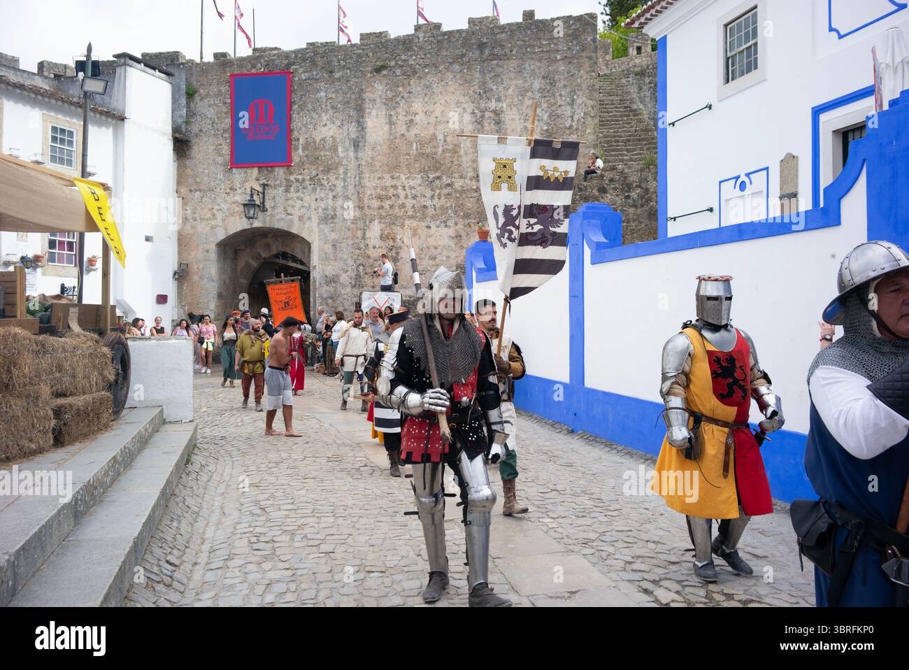 Medieval Market of Óbidos, Portugal, a procession with participants dressed  in costume, Stock Photo