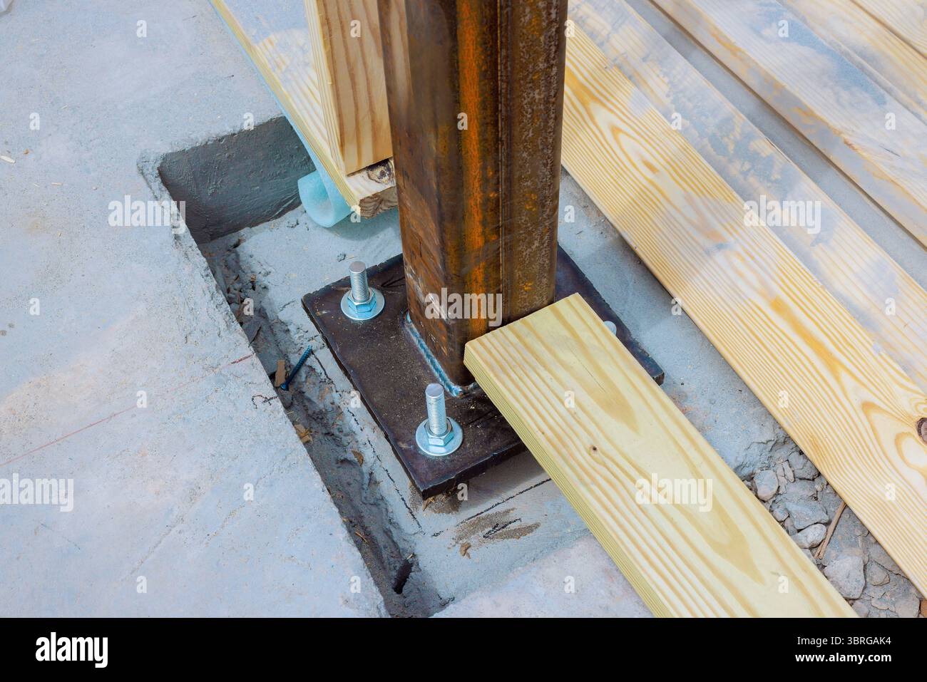 Wooden post anchored in install steel metal column to concrete ...