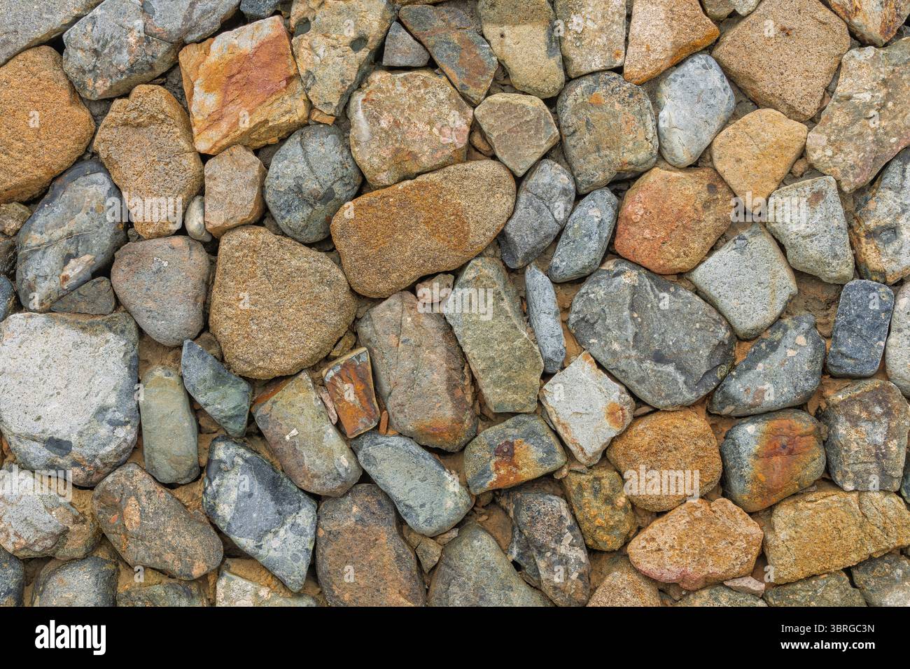 Natural stone wall textured background. Stone wall,Texture of a wall built Stock Photo