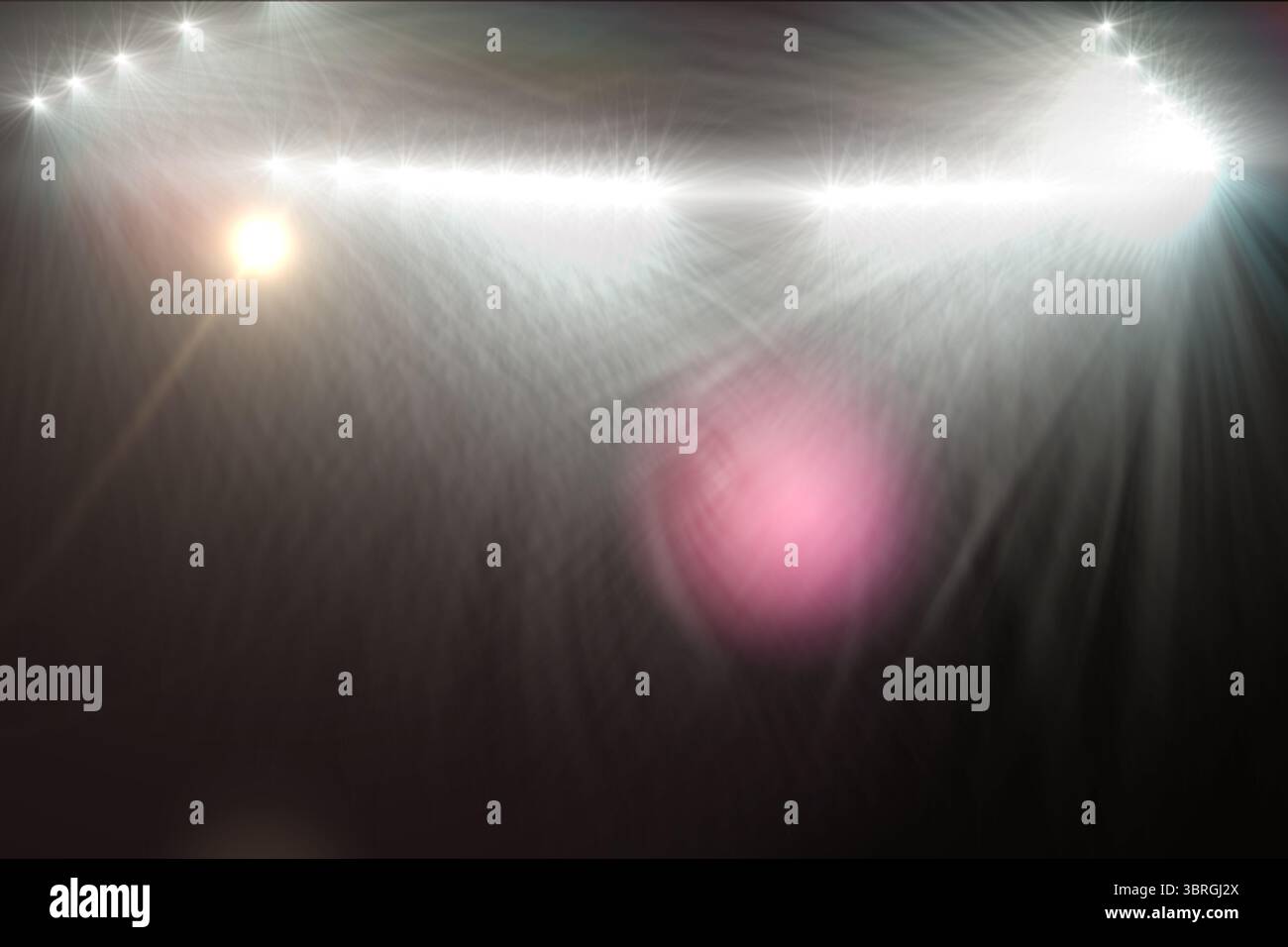 Multiple bright lens flares, starbursts and colored orbs are streaming across dark flat backdrop Stock Photo
