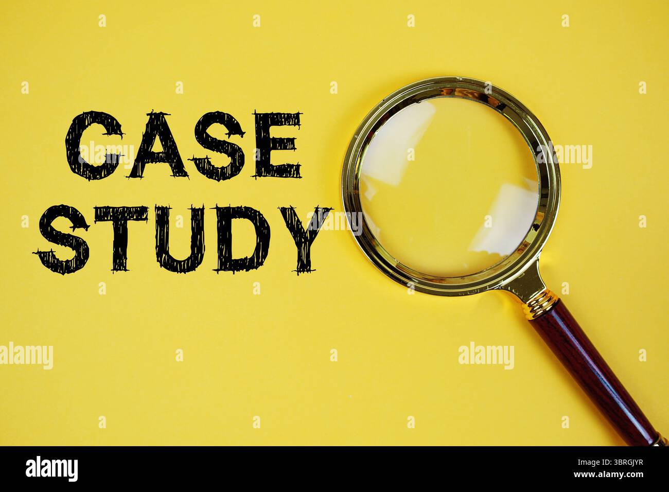 Case Study text with magnifying glass on yellow background Stock Photo