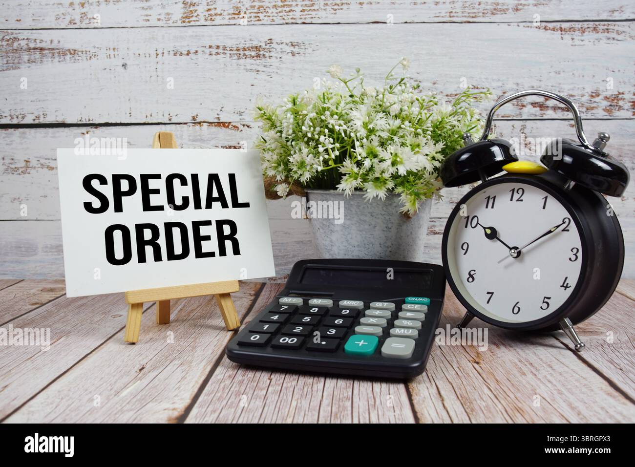 Special Order text with alarm clock and calculator on wooden background Stock Photo