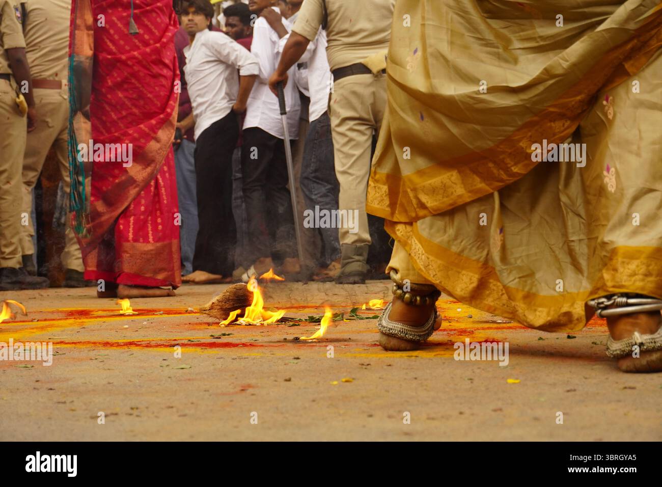 Devotees walking over fire during Bonalu festival ritual in Hyderabad, India Stock Photo