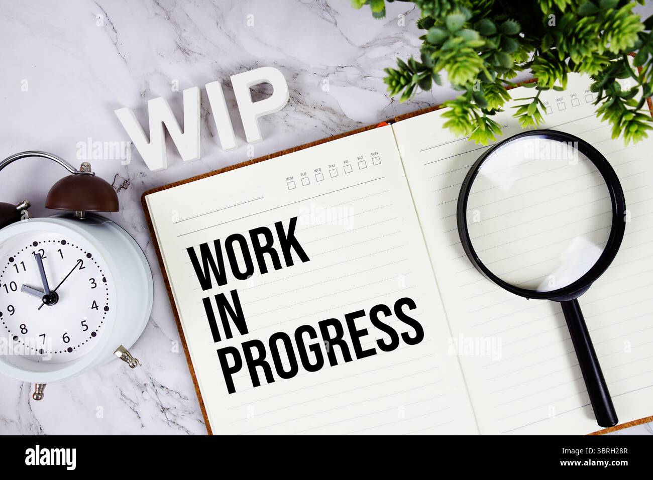 WIP - Work In Progress acronym on notepad, Business concept background Stock Photo