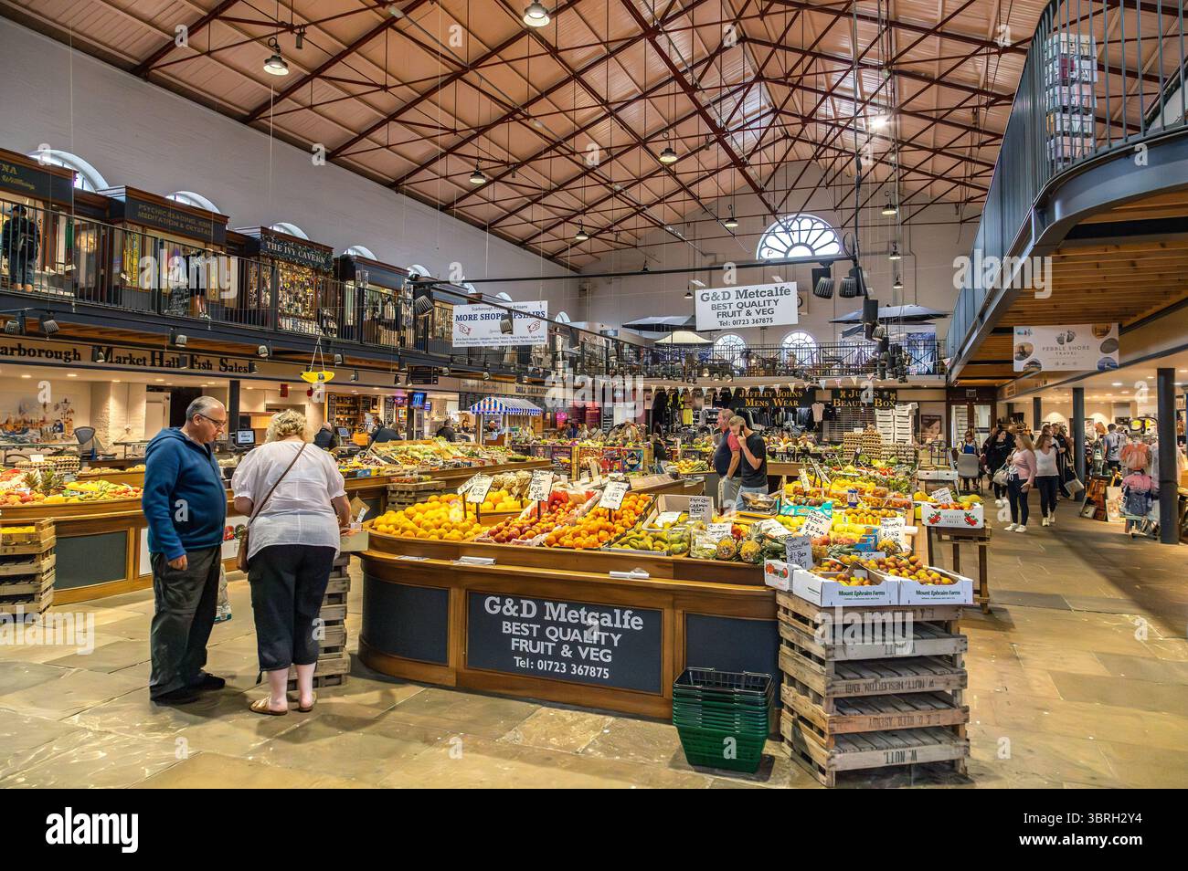 Scarborough Market Hall interior with shoppers browsing fresh produce ...