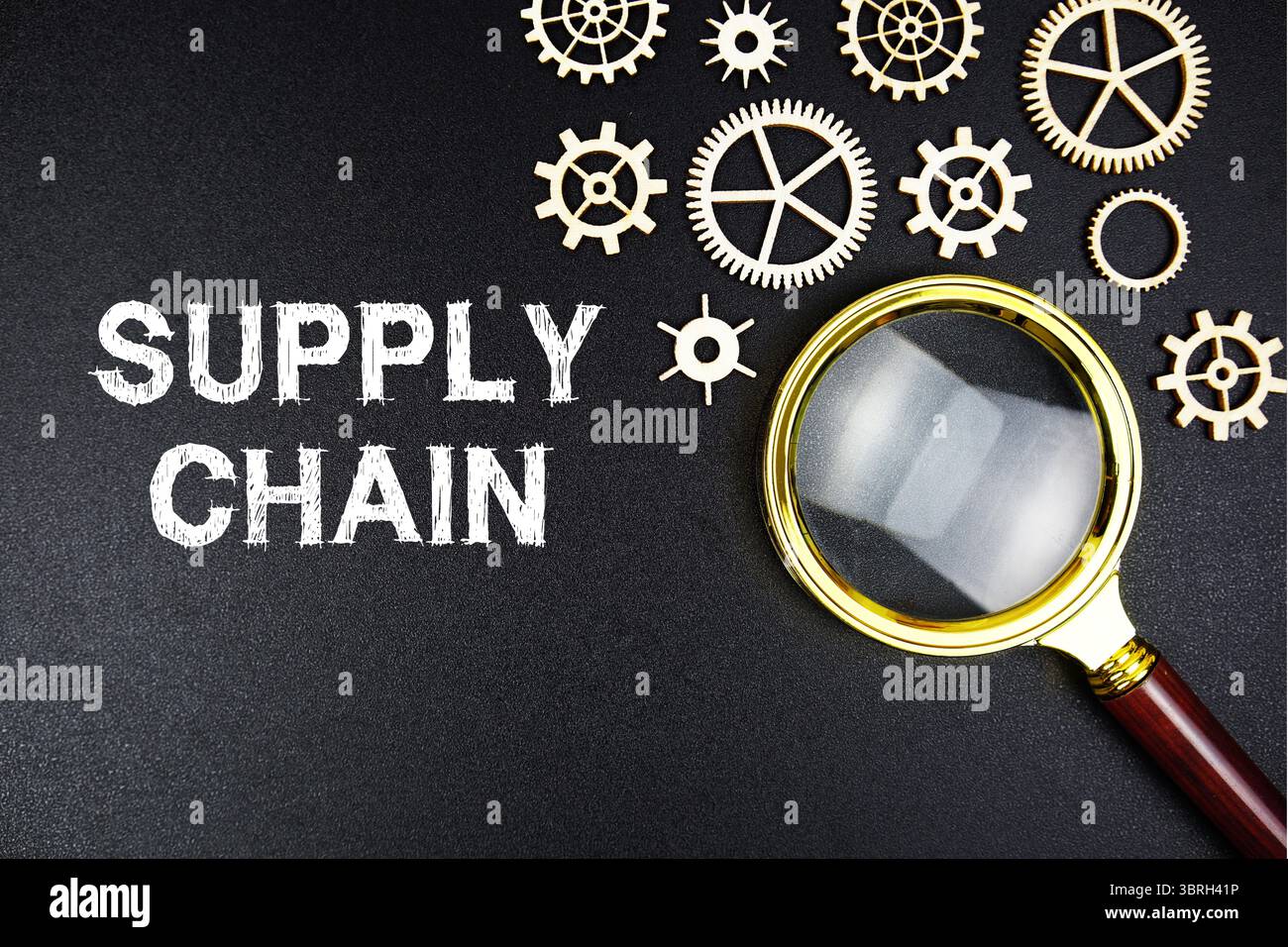 Suply Chain text message with magnifying glass on black background Stock Photo