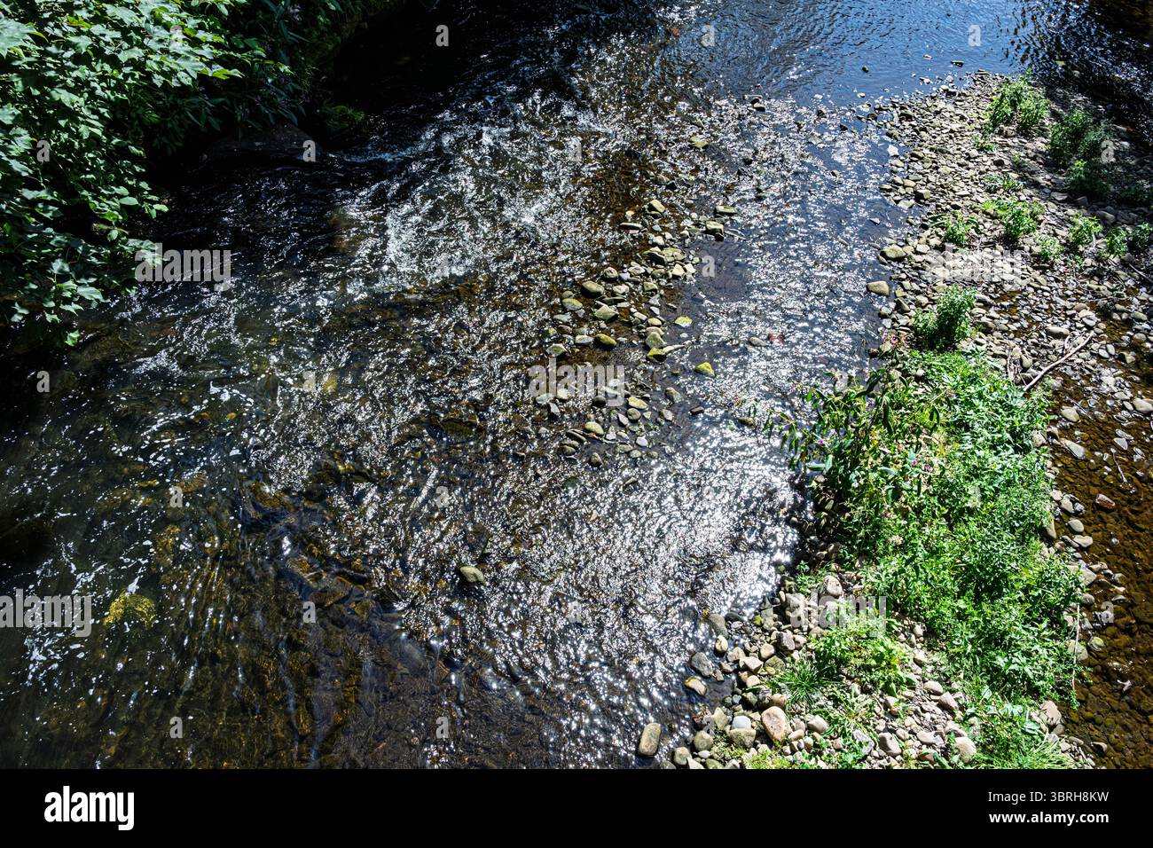 Sparkling water on fast flowing river. Stock Photo