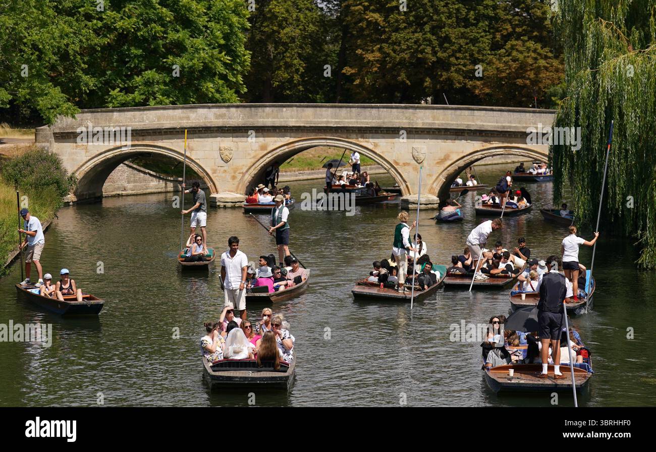 People Punting Along The River Cam In Cambridge As The Third Heatwave 