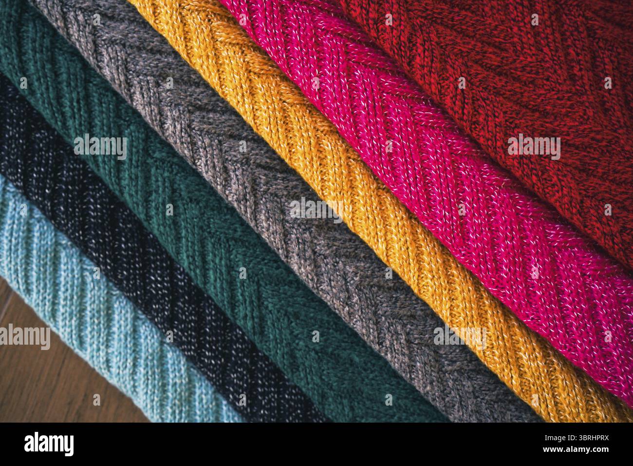 Multi colored Knitted woolen fabric texture background for winter Stock Photo
