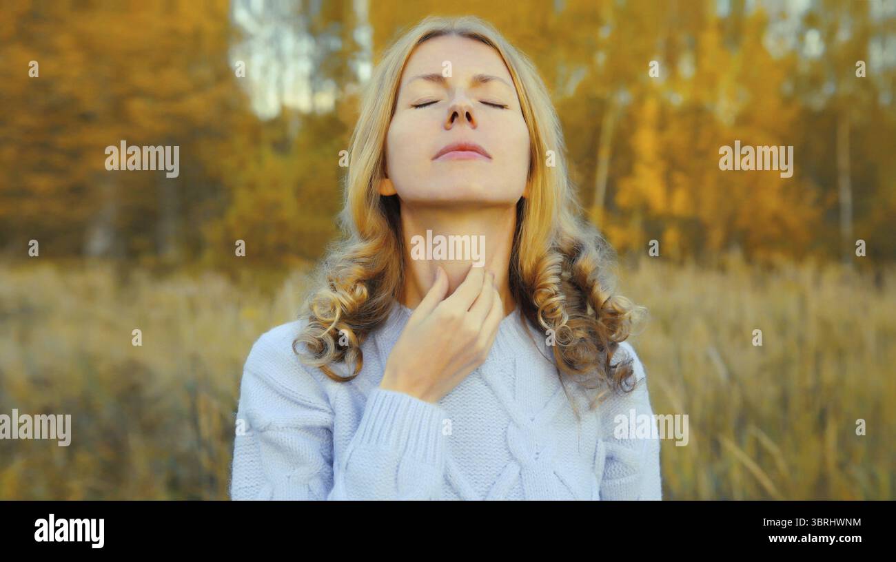 Sick exhausted young woman suffering from acute sore in throat flu ...