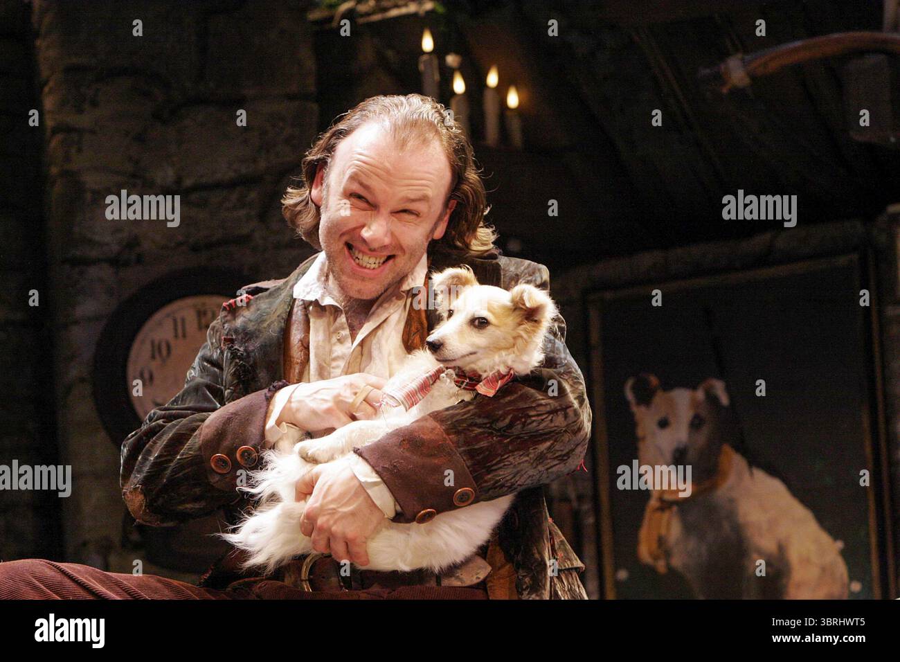 Don Wycherley (Conn - 'The Shaughraun') with Patch as 'Tatters' in THE SHAUGHRAUN by Dion Boucicault at the Albery Theatre, London WC2  08/06/2005  an Abbey Theatre, Dublin production  set design: Francis O'Connor  costumes: Joan O'Clery  lighting: Rupert Murray  choreographer: Colin Dunne  director: John McColgan Stock Photo