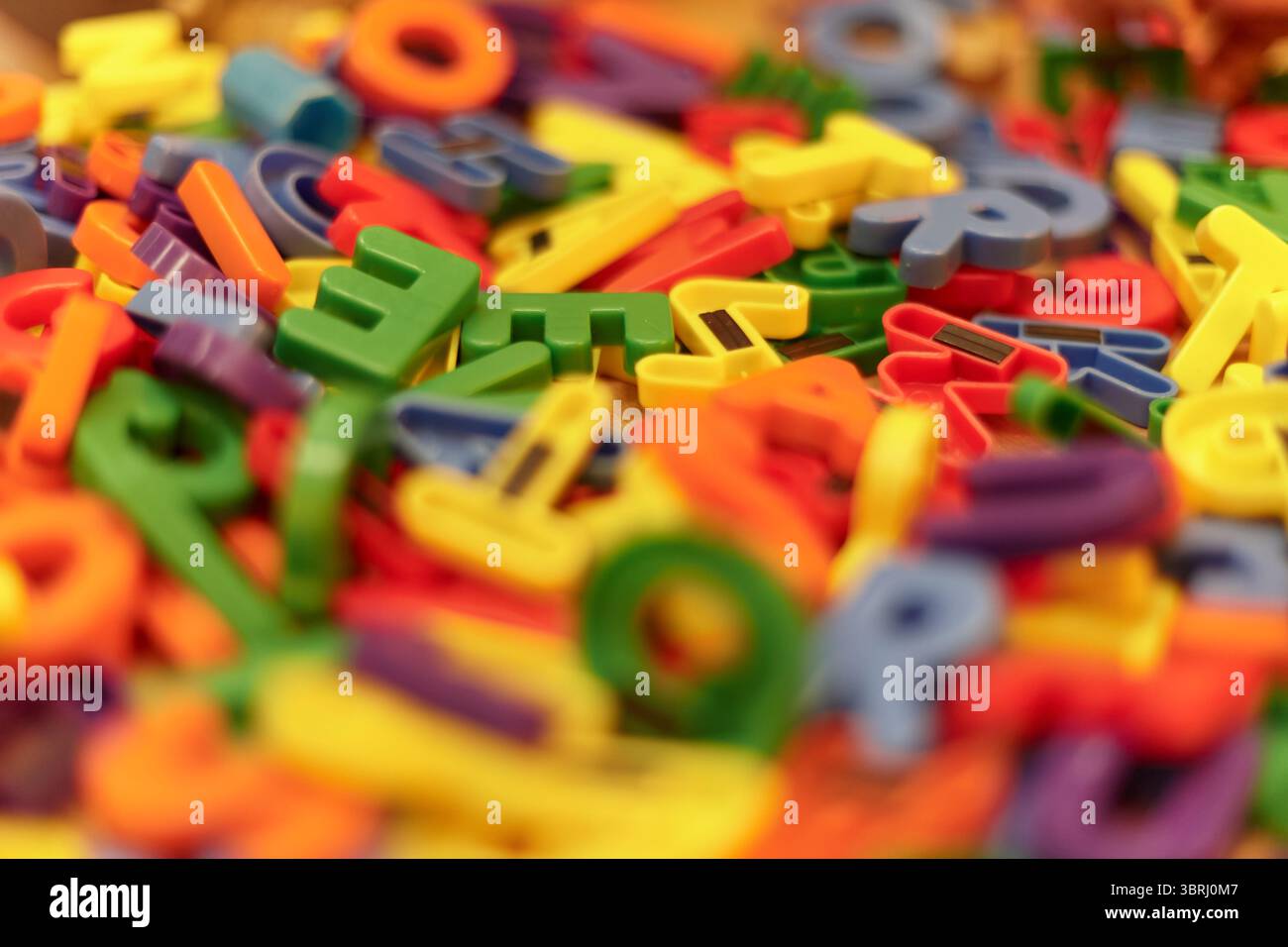 Colored Letter R Magnets Brightly colored plastic letter magnets in various shapes and sizes are ...