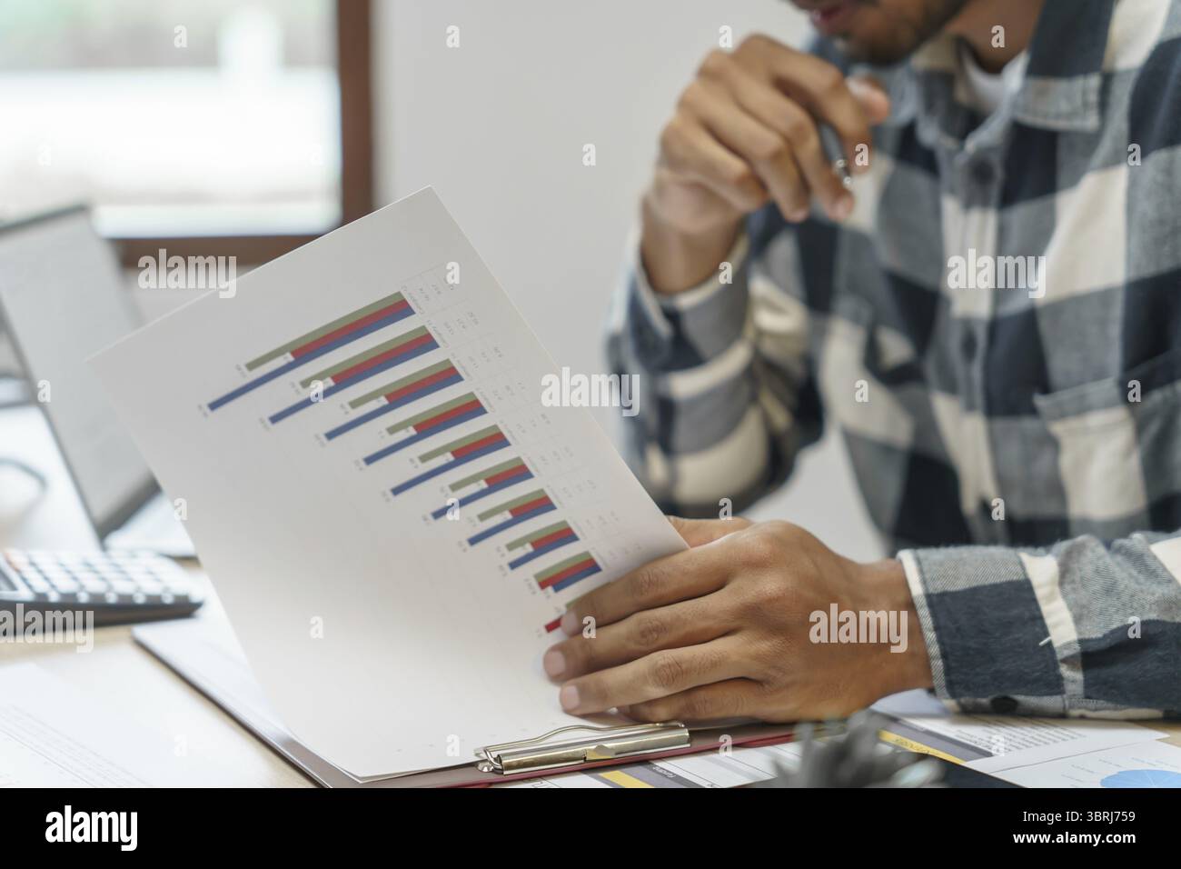 Thoughtful businessman think of online project Serious millennial Business man using laptop computer and professional working investor start up projec Stock Photo