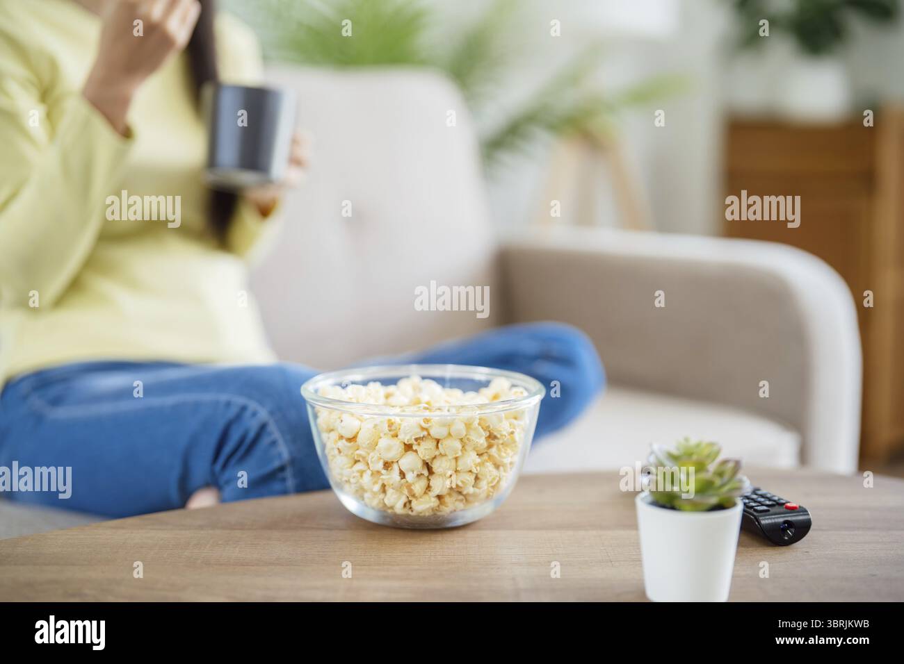 Asian woman Watching smart TV and using remote controller Hand holding ...