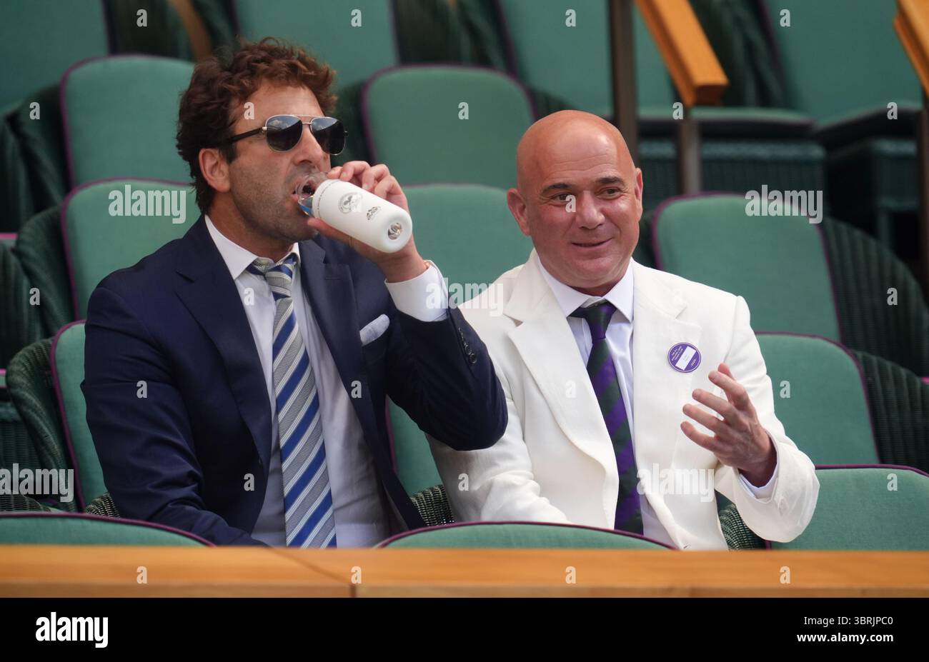 Andre Agassi (right) with Justin Gimelstob in the Royal Box on day ...