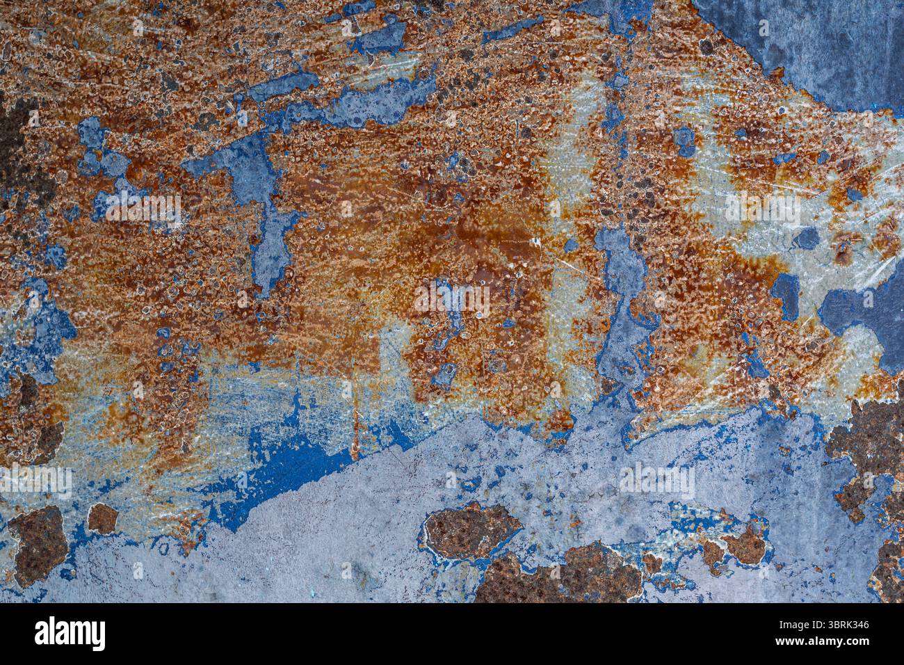 Rusty and Weathered Metallic Surface with Blue and Orange Texture Stock Photo