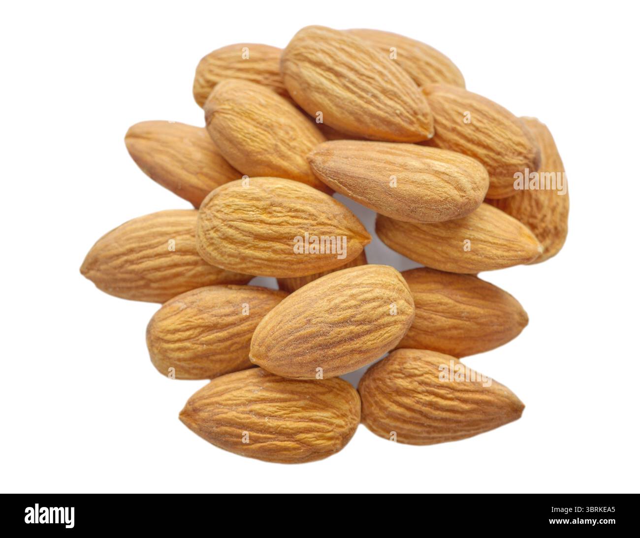 Close up of almonds isolated on white background, selective focus. Stock Photo