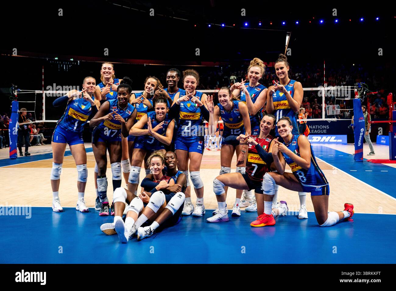 APELDOORN, NETHERLANDS - JULY 13: Anna Gray of Italy, Ekaterina Antropova of Italy, Alice Carlotta Degradi of Italy, Carlotta Cambi of Italy, Monica De Gennaro of Italy, Eleonora Fersino of Italy, Alessia Orro of Italy, Anna Danesi of Italy, Linda Nwakalor of Italy, Stella Nervini of Italy, Myriam Fatime Sylla of Italy, Paola Ogechi Egonu of Italy, Sarah Luisa Fahr of Italy and Gaia Giovannini of Italy celebrate their team’s win during the Women's 2025 Volleyball Nations League - Apeldoorn match between Netherlands and Italy at the Omnisport on July 13, 2025 in Apeldoorn, Netherlands. (Photo b Stock Photo