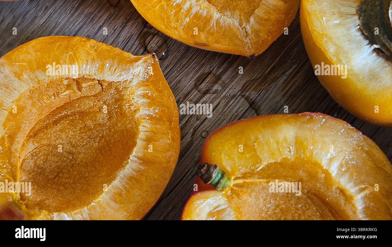 Halved Apricots on Rustic Wooden Table - Smartphone Captured Stock Image