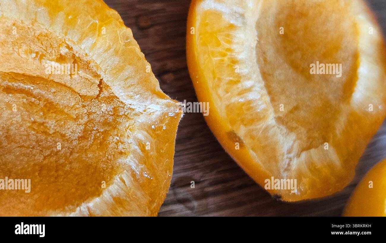 Halved Apricots on Rustic Wooden Table - Smartphone Captured Stock Image