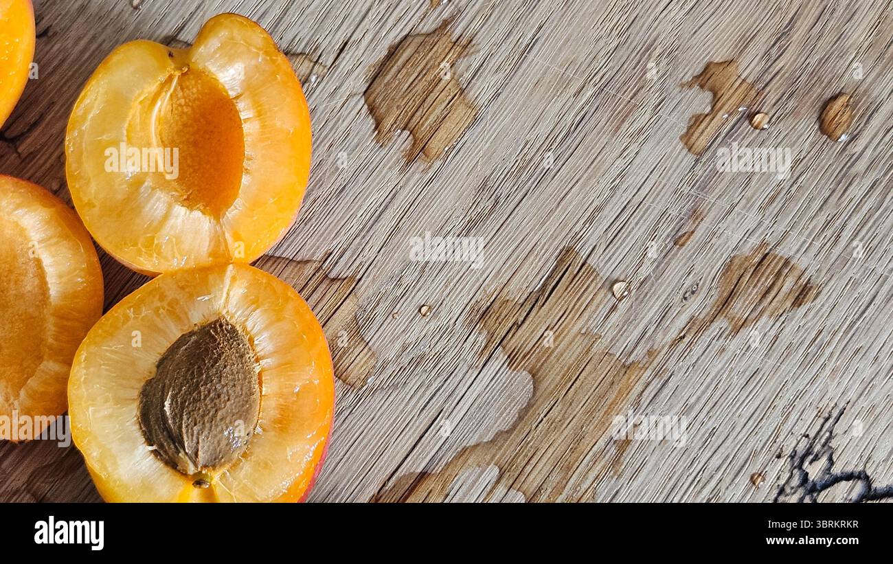 Halved Apricots on Rustic Wooden Table - Smartphone Captured Stock Image
