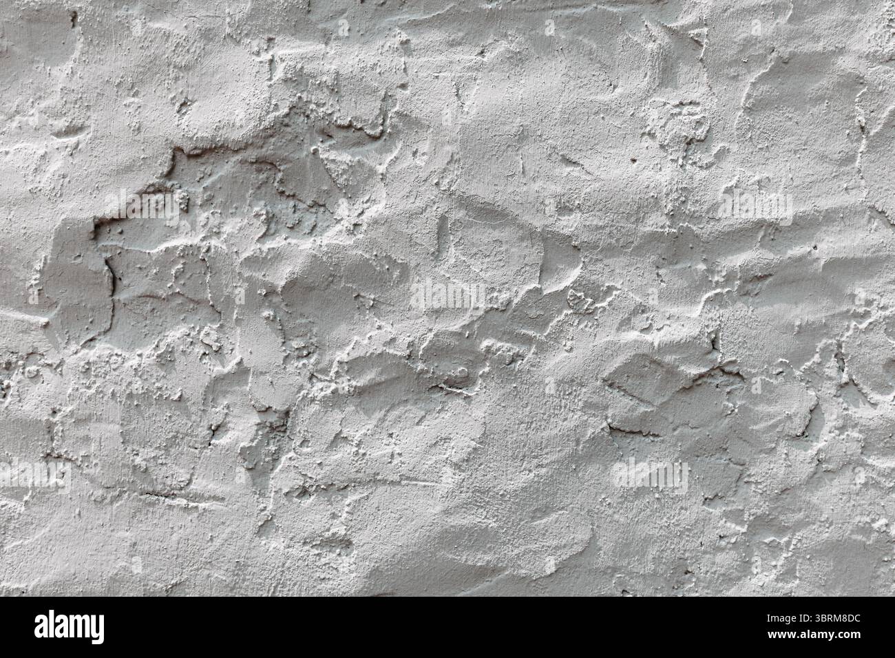 Close up view of a textured concrete wall, showcasing its rough and ...