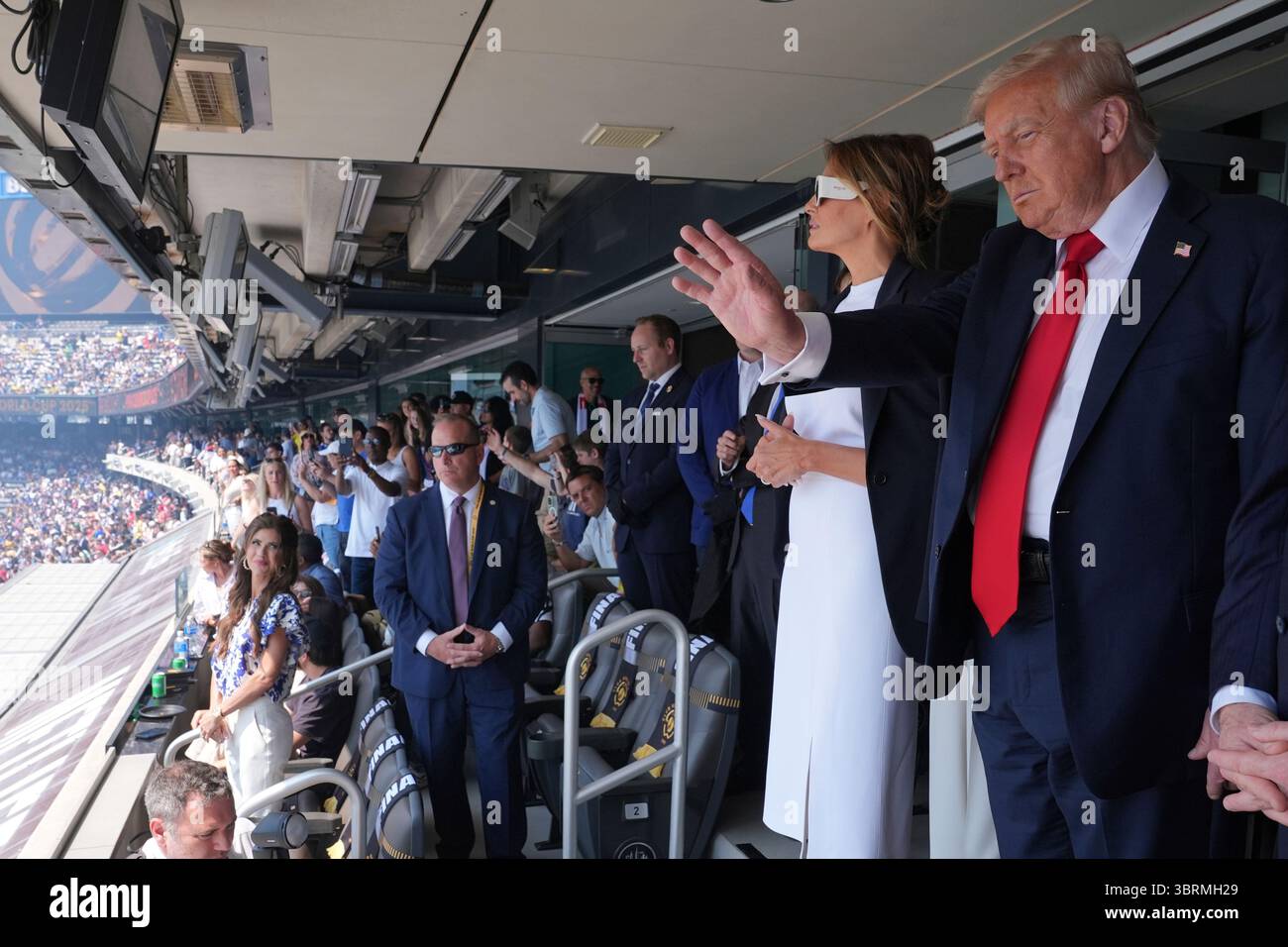 President Donald Trump, right, and first lady Melania Trump attend the