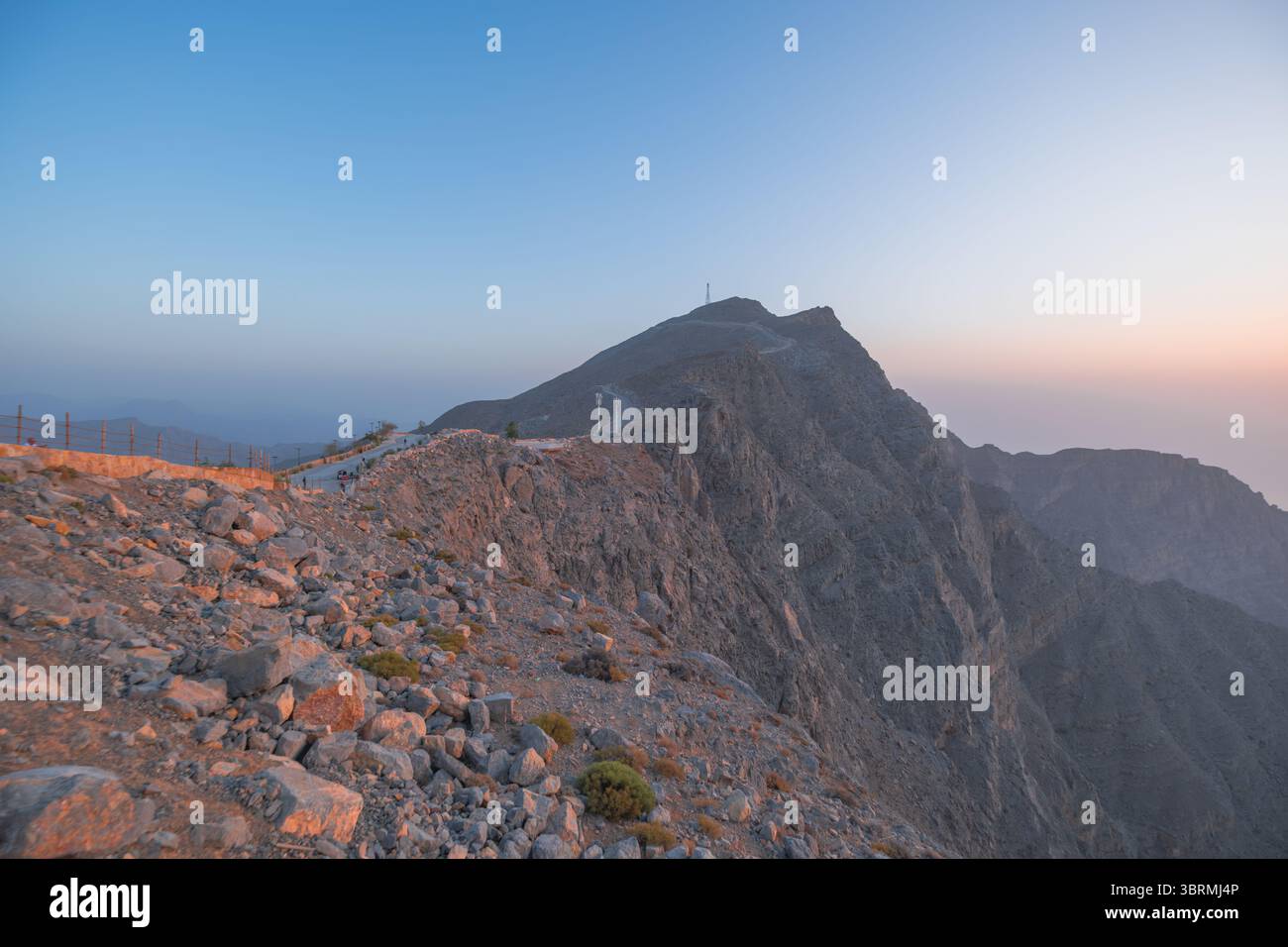 View of mountain peaks from hike at sunset, sceneic rocky mountains of UAE Stock Photo