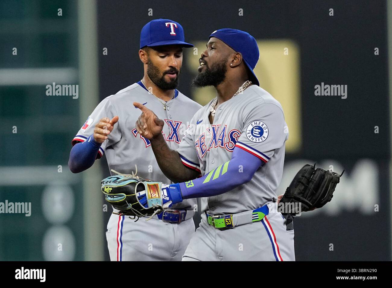 Texas Rangers’ Marcus Semien, left, and Adolis García celebrate after a