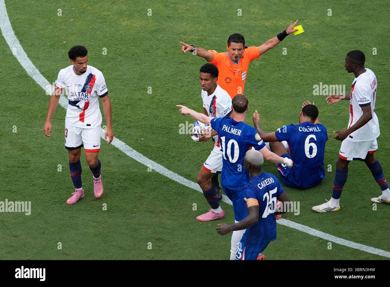 Referee Alireza Faghani, of Australia, shows a yellow card to Chelsea's ...