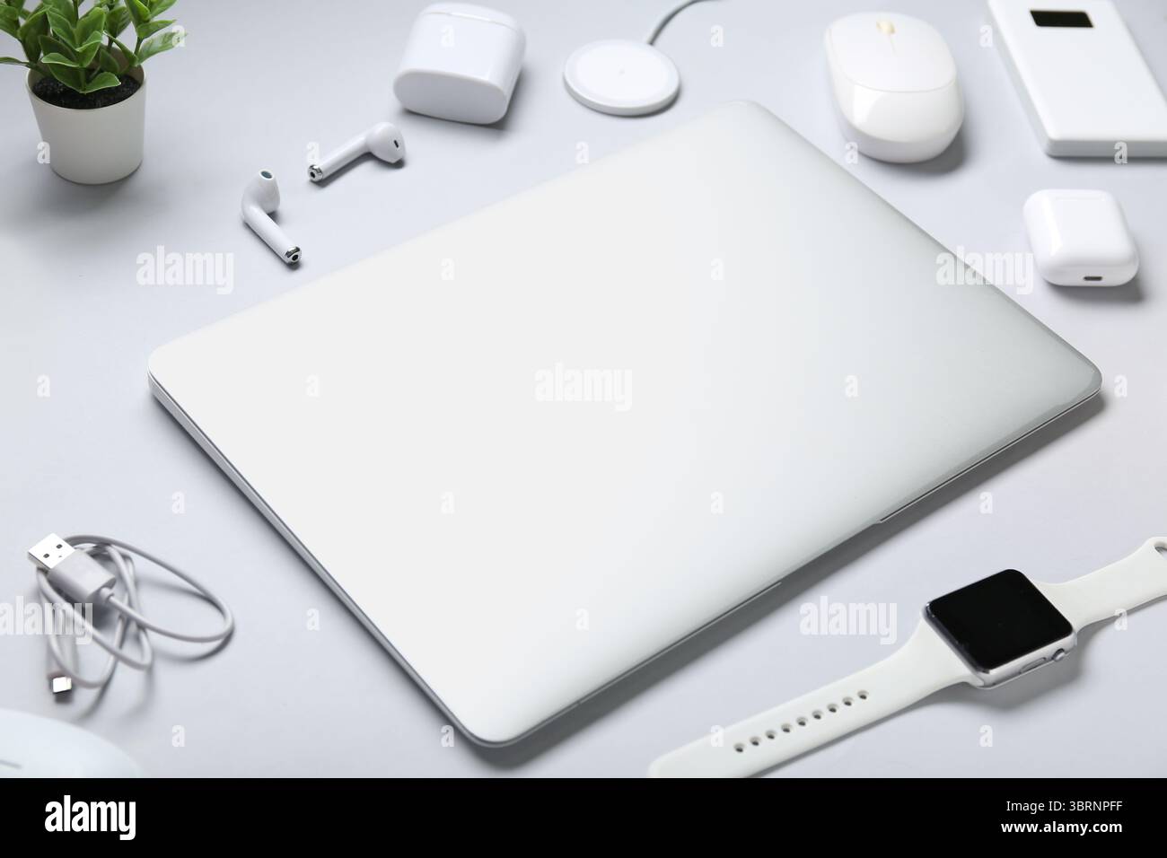 Composition with different modern gadgets on grey background Stock Photo