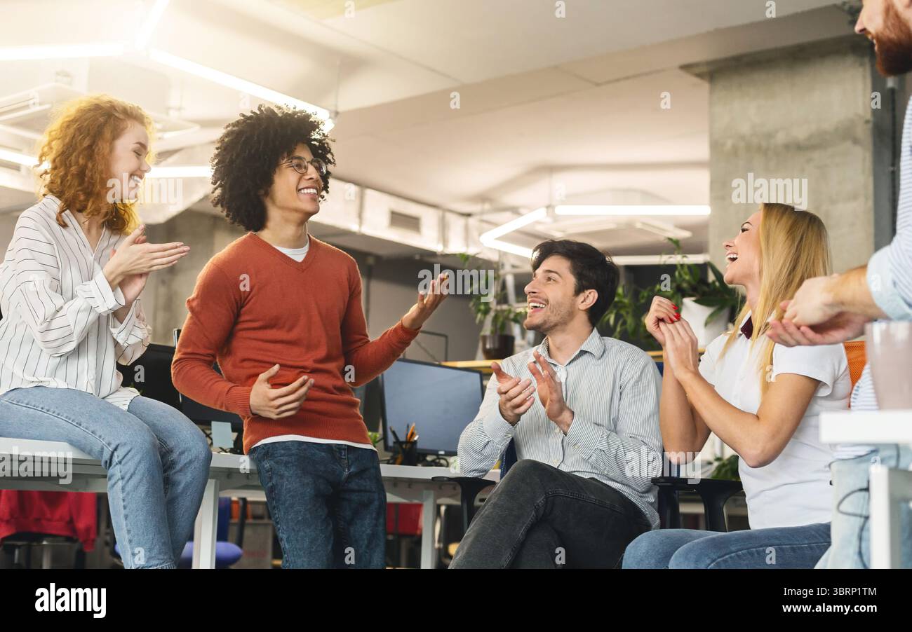 Creative team enjoying communication in modern office Stock Photo