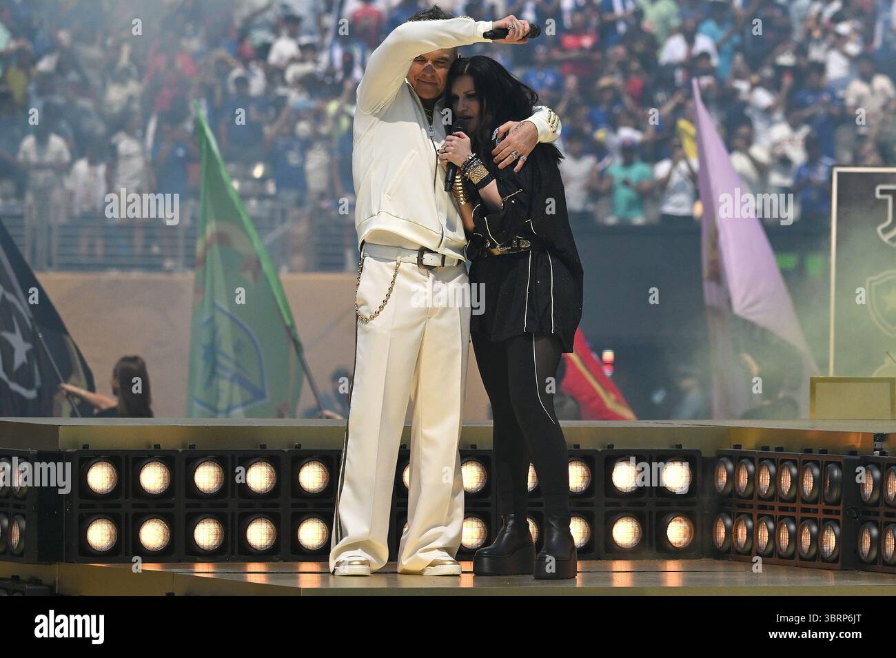 East Rutherford, USA. 13th July, 2025. (L-R) Singers Robbie Williams ...