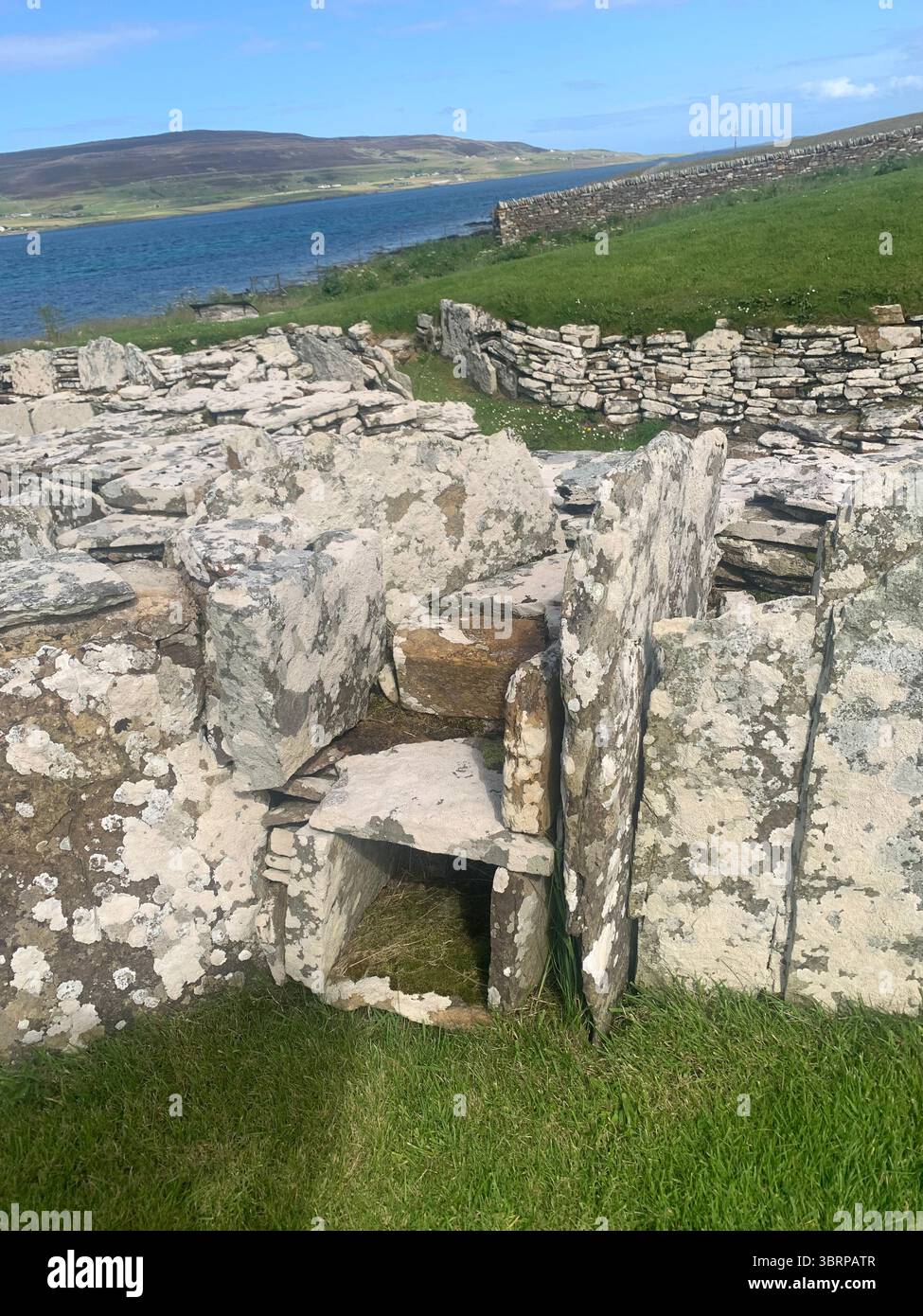 The Broch of Gurness Scotland Orkneys Orkney sand sea ancient village Iron age buildings people historic history building hidden found landscape shore - Smartphone Captured Stock Image
