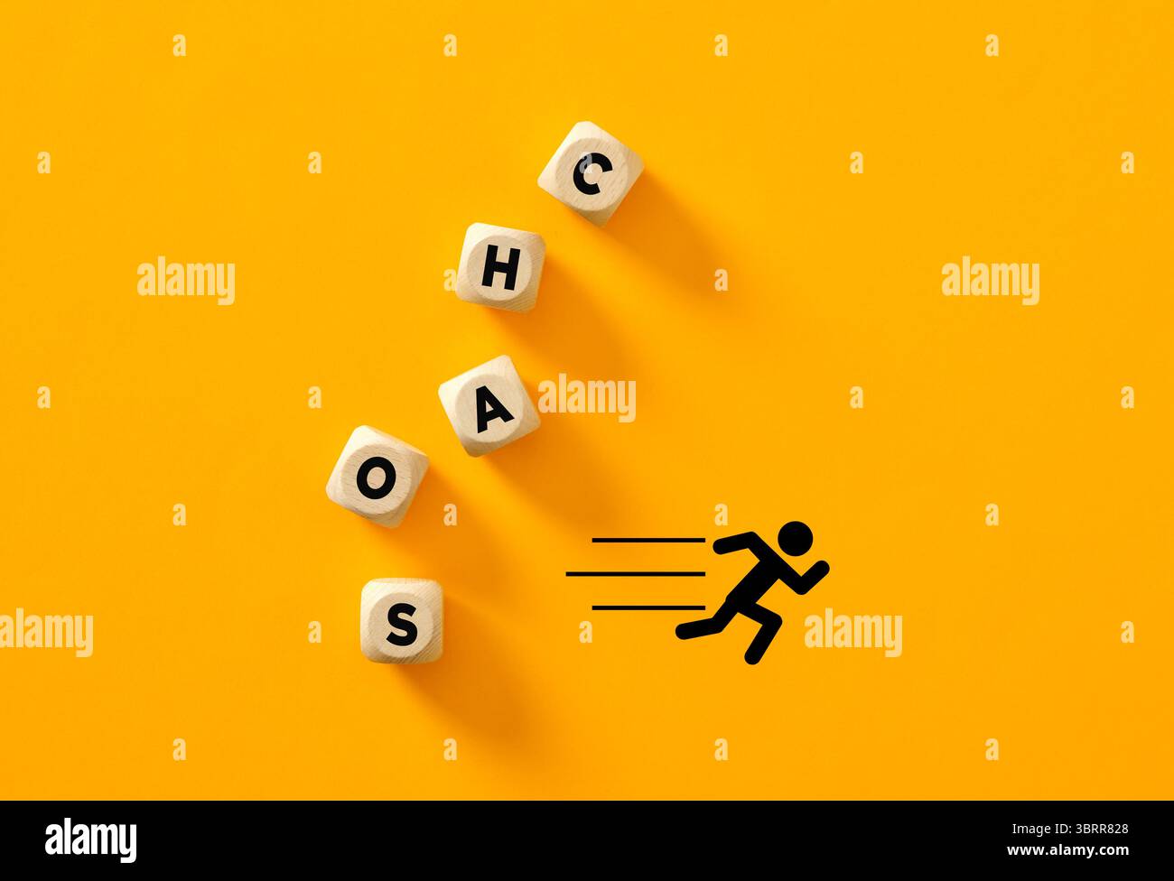 Wooden cubes displaying letters that spell out chaos, complemented by a ...