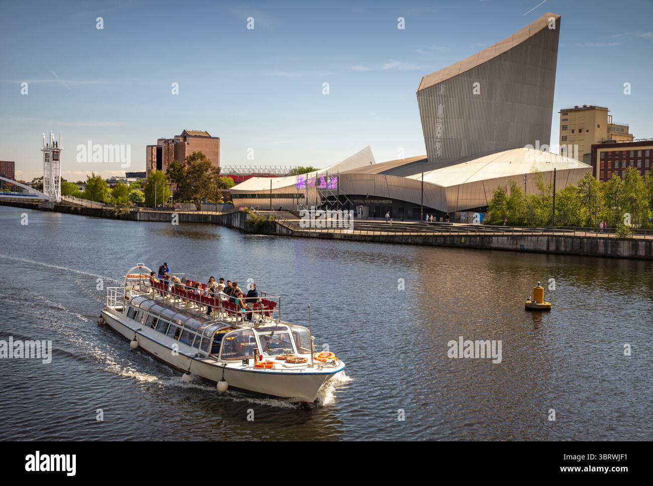 UK, England, Salford, excursion boat in former docks passing Imperial War Museum North Stock Photo