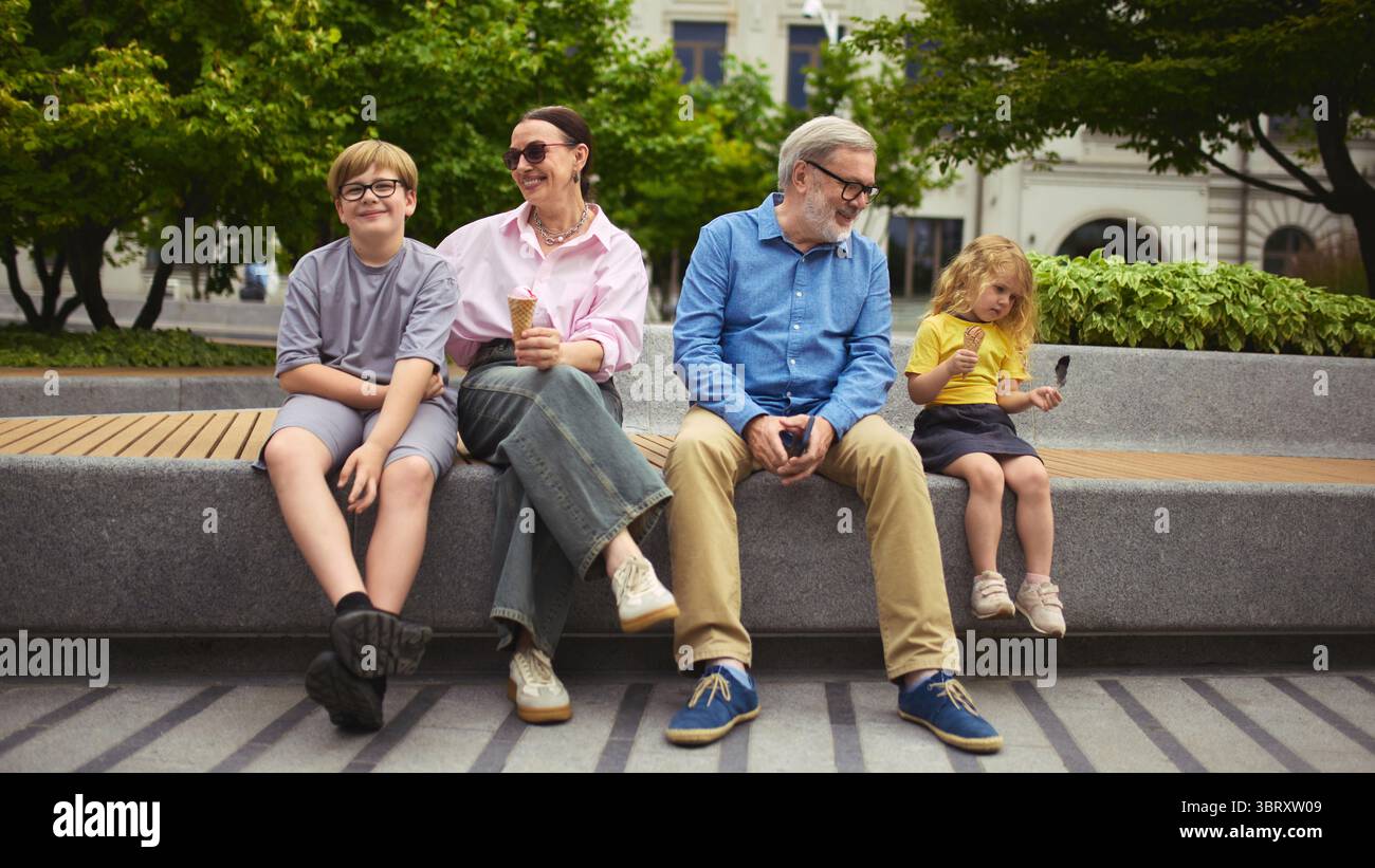 Multigenerational smiling family sitting hi-res stock photography and ...