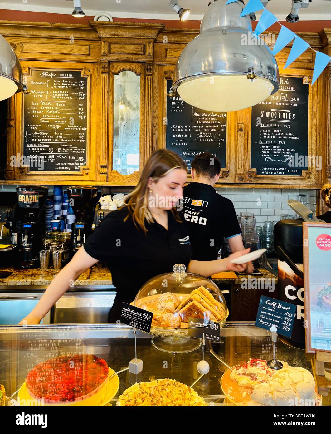 The Green Cafe Nero in the historical building on Krakowskie Przedmieście in the old town of Warsaw, Poland. Stock Photo